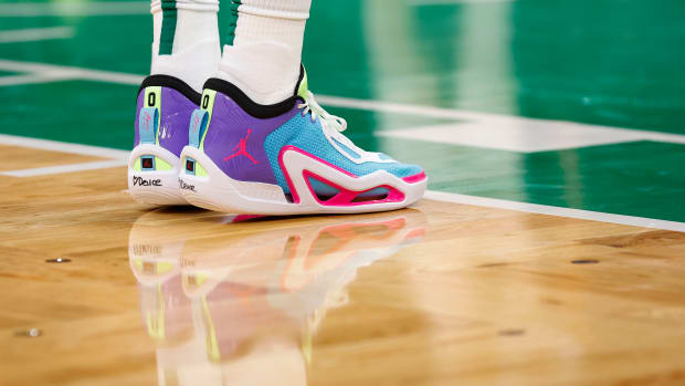 Boston Celtics forward Jayson Tatum's purple and blue Jordan Brand shoes.